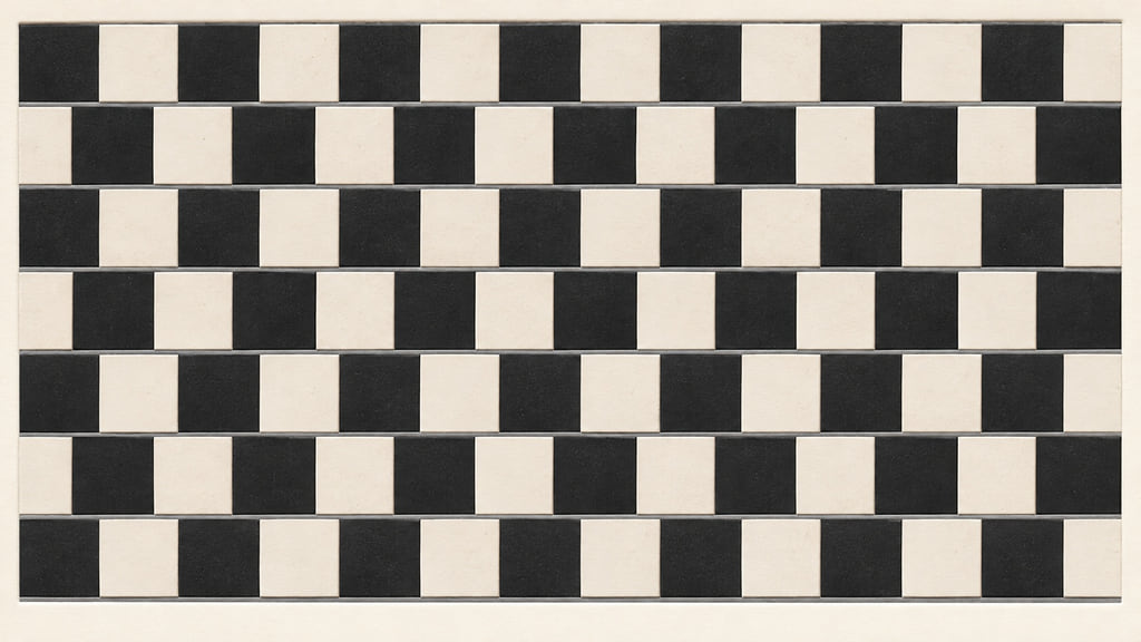 Offset rows of light and dark ceramic tiles create a repeating wall pattern.